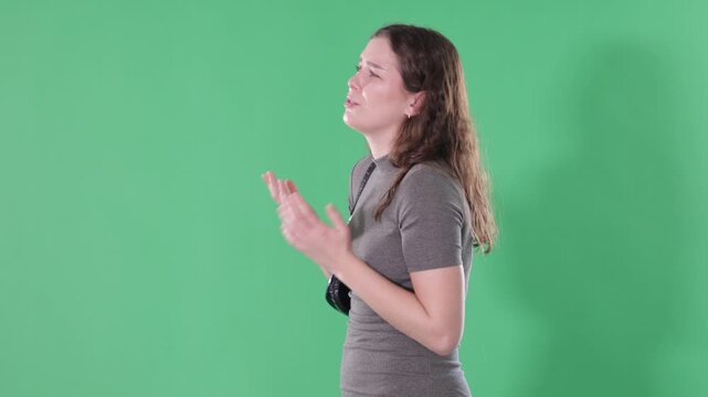Saddened girl, life crisis, bad news. Person has failed, is sad and anxious on green screen. Woman is in difficult life situation. Informational occasion, advertising billet, prototype