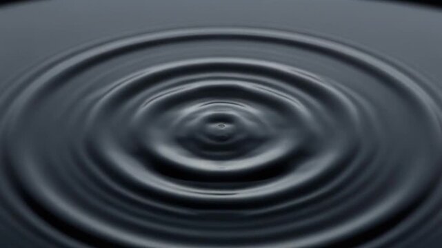 Macro Sequence of Water Droplet Impact Creating Concentric Ripples