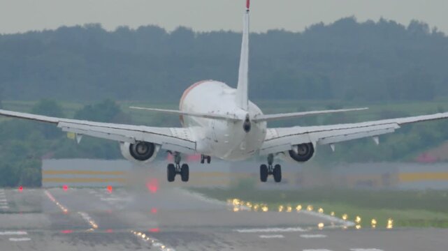Airplane landing on runway with strong crosswind challenge at regional airport during daylight