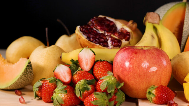 Vibrant Assortment of Fresh Whole and Sliced Tropical Fruits