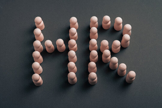 Human Resources HR concept built with wooden figures representing workforce structure and people management