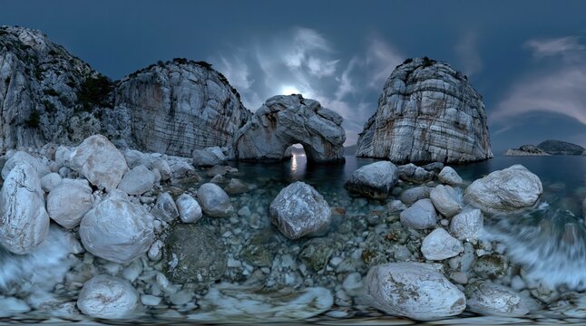 Mysterious ocean cave illuminated by a hidden light source, surrounded by rugged rocks and crashing waves