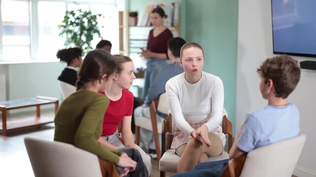 Two teams of teens, participants are negotiating, consulting, rehearsing performance. Acting masters courses, stage speech courses, public speaking courses, group practice of public speaking