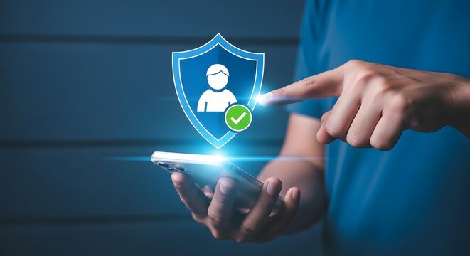 Mobile security concept hand interacting with smartphone displaying digital shield icon with user profile