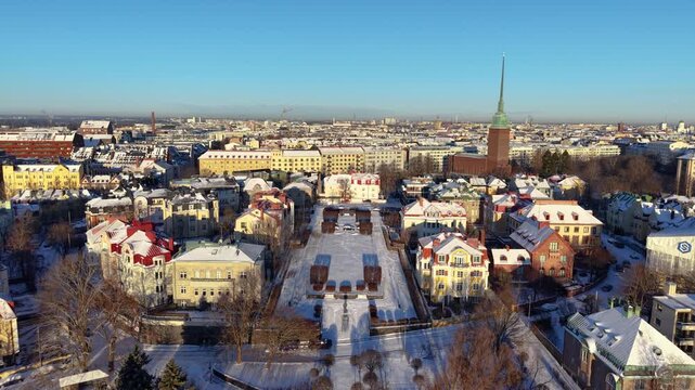 Aerial drone footage of central Helsinki neighborhood called Eira on a clear and cold winter day.