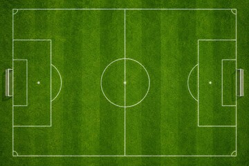 Obraz premium Aerial view of a soccer field with green grass and white markings.