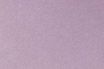 Fototapeta premium Close-up of a textured pink surface with a subtle glitter effect.