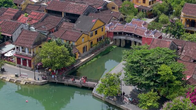 Aerial view of Chua Cau or Japanese Covered ancient Bridge and River in Old city of Hoi An, Vietnam. One of the most travel popular touristic destinations, UNESCO world heritage 