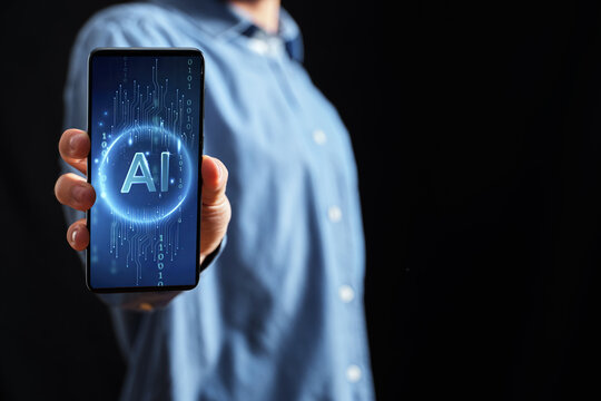 Person holding smartphone displaying artificial intelligence concept