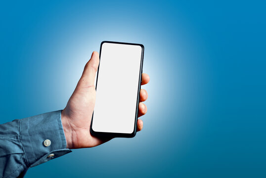 Hand holding smartphone showing blank white screen mockup
