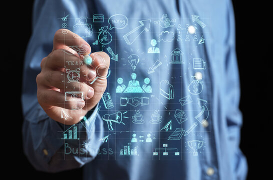 Hand drawing business strategy on virtual screen interface