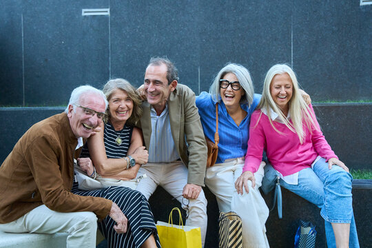 Senior friends enjoying urban shopping together