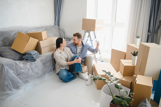 Happy couple moving to new home apartment together