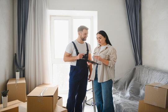 Moving service professional helping woman sign relocation contract