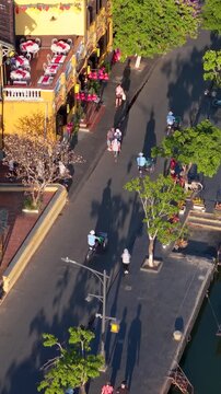 Aerial panoramic view of Hoi An city, Da Nang province, Vietnam. Pedicabs carrying tourists for sightseeing in the old town, UNESCO world heritage. One of the most travel popular touristic destination