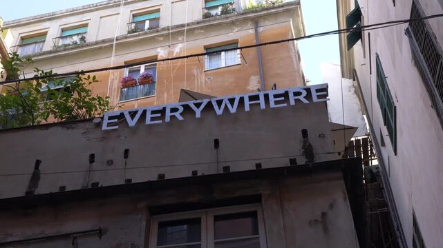 Urban street sign detail in Genoa city center, Italy