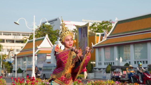 Traditional Thai Khon Dancer Performs Manohra Dance at Wat Suthat Temple