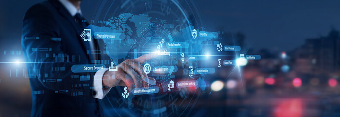 Fototapeta premium Financial services. Banker hand touching Banking words and icons on a mobile device. Managing global investments and secure electronic fund transfer solutions for clients.