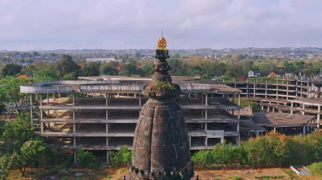 Bajra Sandhi or Monumen Taman Mumbul monument to the struggle for independence in the rays of the rising sun. Bali, Indonesia. 4K Aerial view