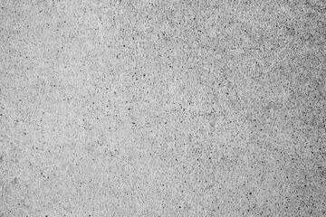 Fototapeta premium Textured background of a rough grey concrete wall surface showing detailed granular speckle texture