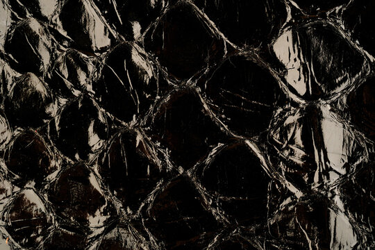Exotic glossy reptile leather texture with python scale pattern for fashion background