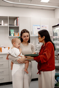 Healthcare professional sharing medical documents with family
