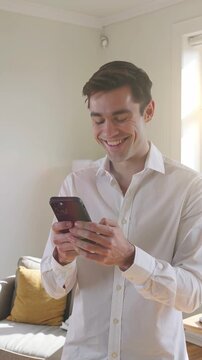 Worried Young Man Using Smartphone, Reading Message with Concern at Home.