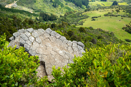 Volcanic basalt rock columns and farmland