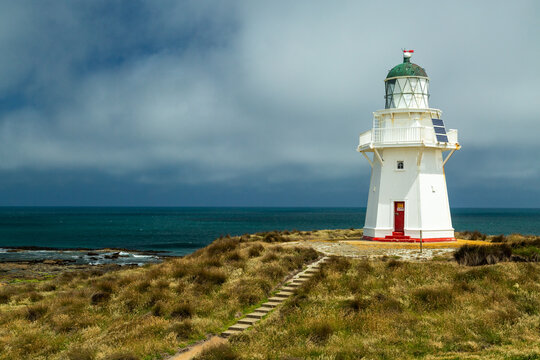 Waipapa Point Lighthouse atop a coastal hill