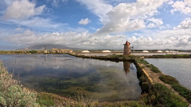 Old wind mill for the extraction of the salt. Sicily, Italy Slow motion