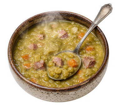 Bowl of hot split pea soup with ham chunks and silver spoon isolated on transparent background