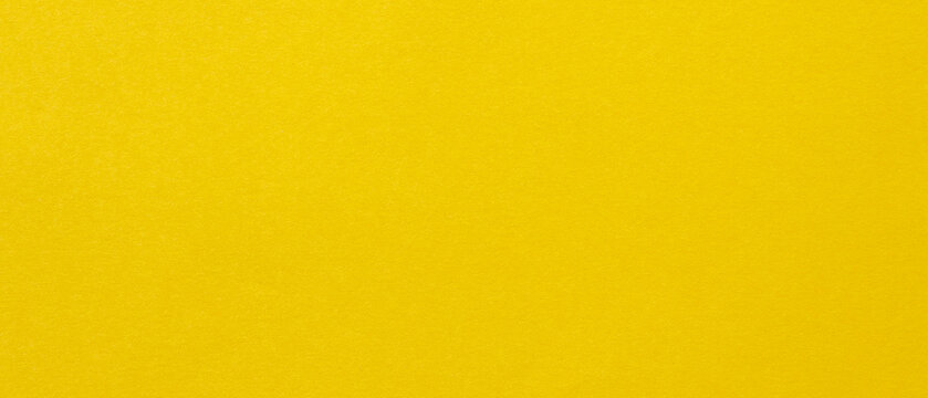 Yellow paper texture background with smooth surface and copy space