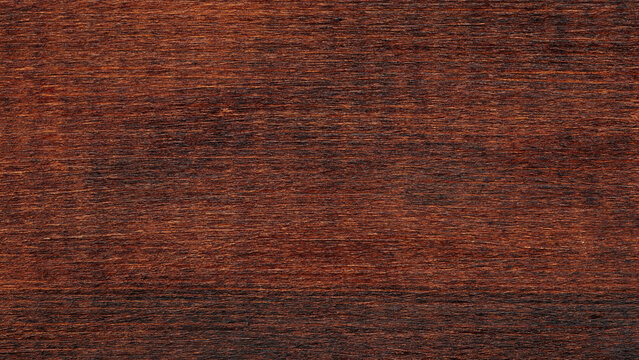 Dark brown wood grain texture background with natural horizontal pattern and surface detail