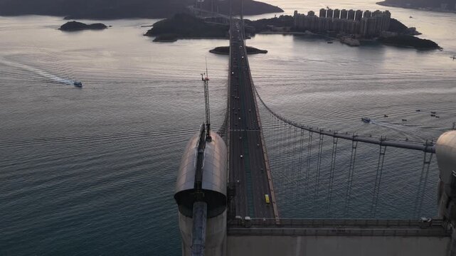 Aerial view of tsing ma bridge traffic in hong kong at sunset