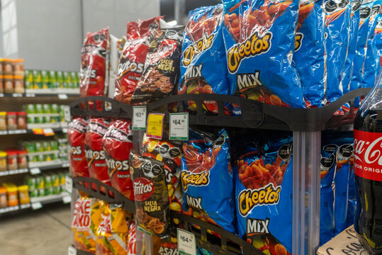 Villa de Alvarez, Colima. Mexico. May 18, 2026: Cheetos and other snack brands on a shelf in a supermarket.