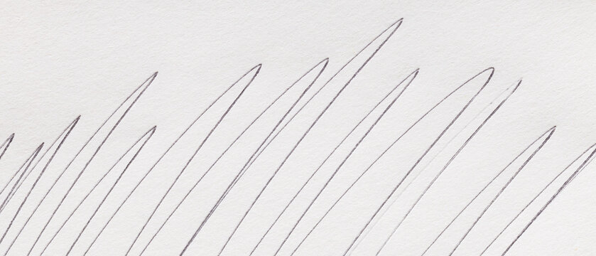 Abstract pencil scribble lines on white textured paper for a creative minimalist background