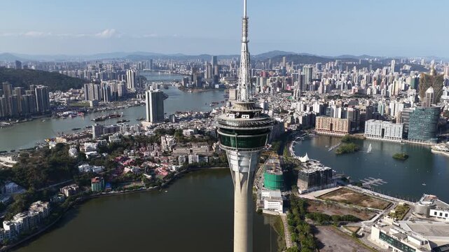 Aerial view flying past macau tower convention and entertainment center