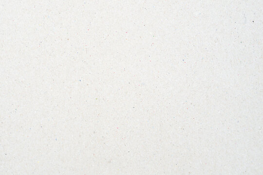 Close-up of clean white recycled paper texture with subtle organic fiber flecks, high-quality seamless cardboard surface background for eco-friendly design, sustainable packaging, and minimalist backd