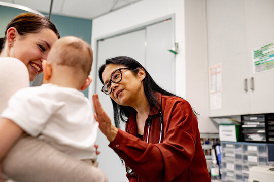 Female doctor comforting a child