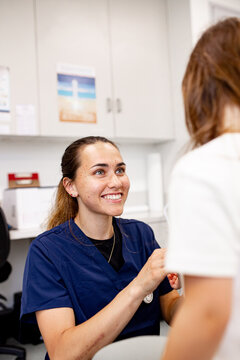 Healthcare professional consulting with patient in clinic