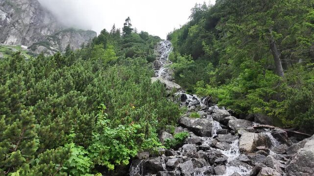 Gentle Water Flow Over Rocky Terrain in Morskie Oko, Poland