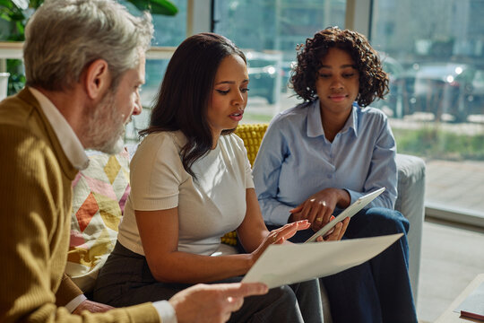 Diverse business team collaborating during meeting in office