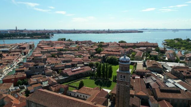 Aerial view of Chiesa di San Pietro Martire bell tower and rooftops in Murano, Venice