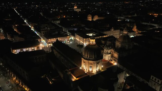 Aerial View of Catania City Center, Sicily Italy at Night, Metropolitan Cathedral of Saint Agatha in Lights, Drone Shot