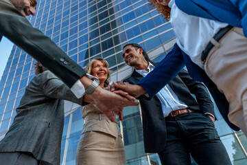 Fototapeta premium Business team stacking hands showing unity and support