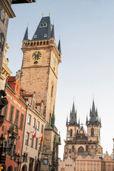 Obraz premium Historical Old Town Square in Prague, Czech Republic, featuring the iconic Astronomical Clock tower and the Church of Our Lady before Týn