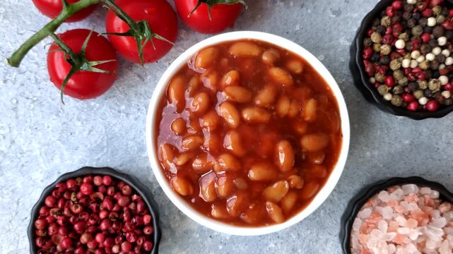 Beans in tomato sauce, a canned stew for the dinner table. Beans in tomato sauce as a food background for your design