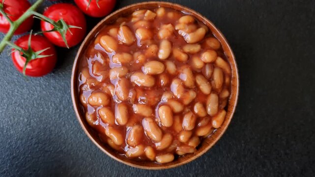 Beans in tomato sauce, a canned stew for the dinner table. Beans in tomato sauce as a food background for your design