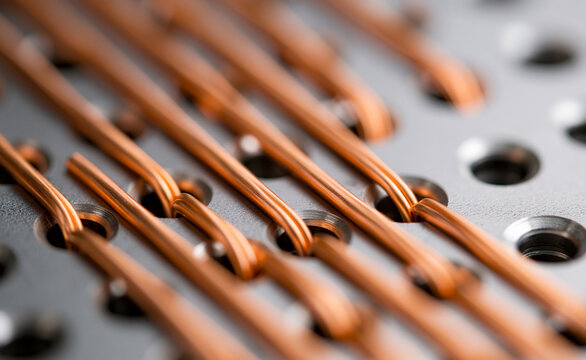 Close-up texture of copper wires aligned in a manufacturing facility