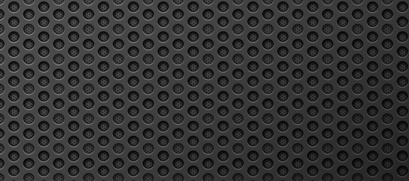 Perforated circular metal pattern embossed industrial gray.